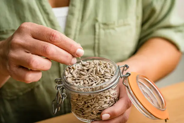 sunflower seeds planting depth hands