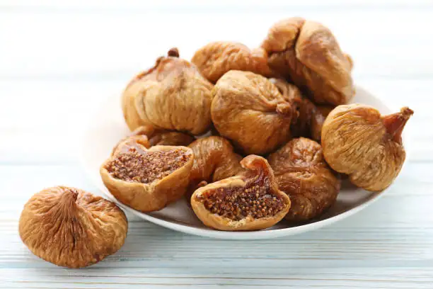 fresh and dried figs on plate