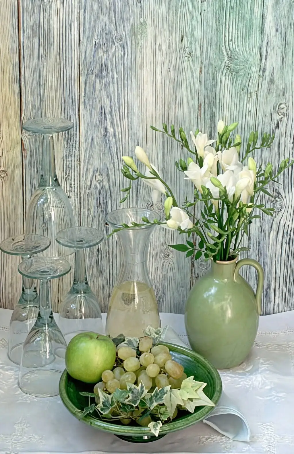 freesia vase beside fruit bowl