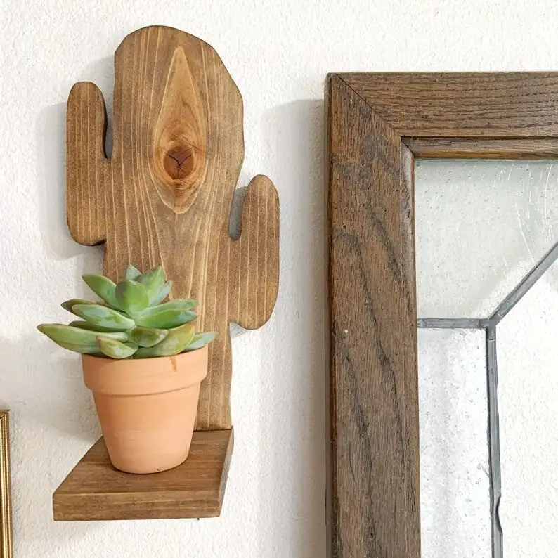 easter cactus on wooden wall shelf