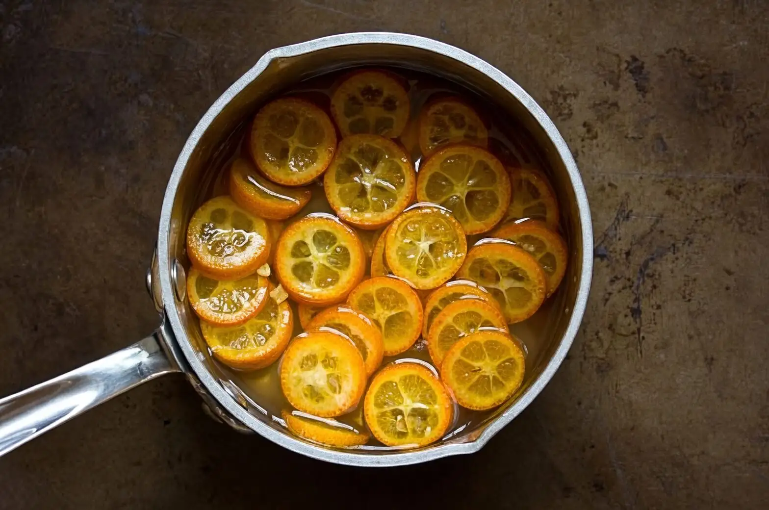 candied kumquat slices in syrup