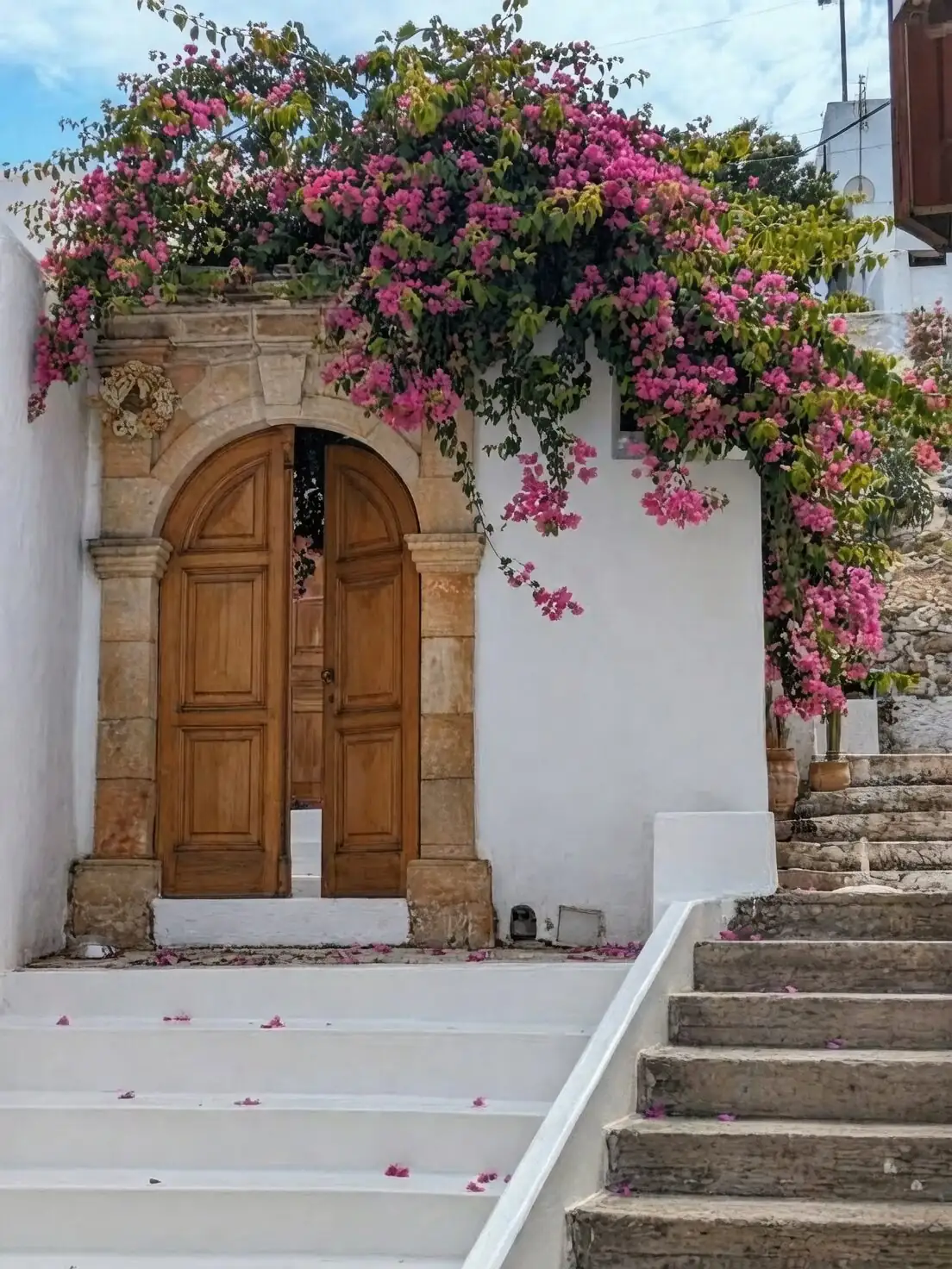 bougainvillea on Mediterranean stone arch