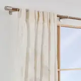 sago palm by window sheer curtain