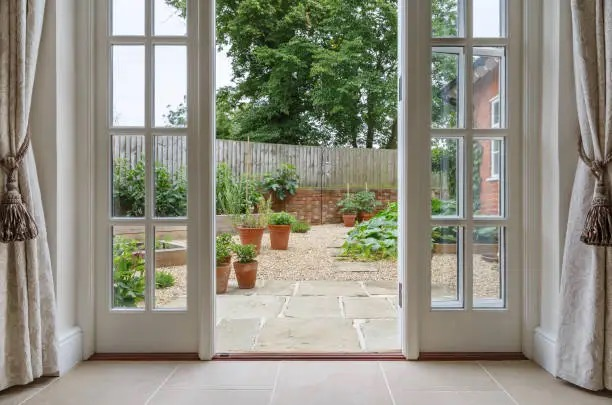 French marigold pots by doorway