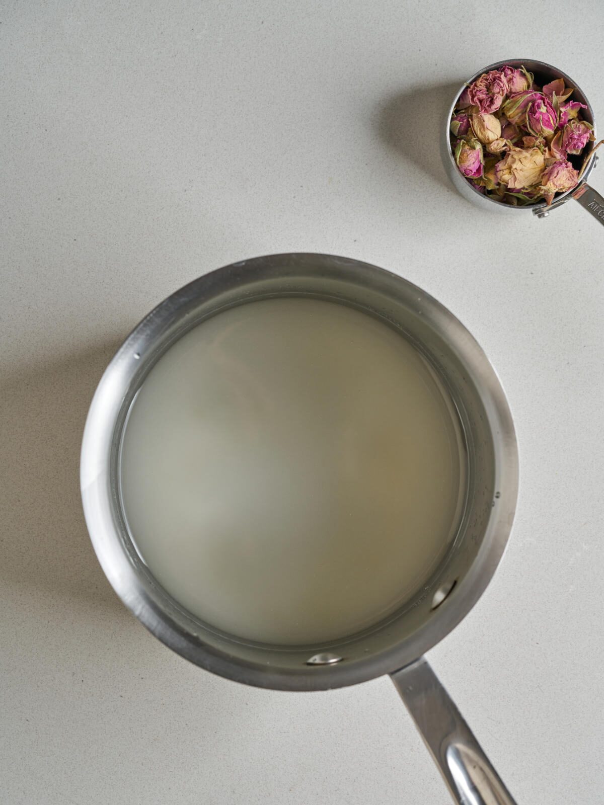 rose geranium simple syrup saucepan
