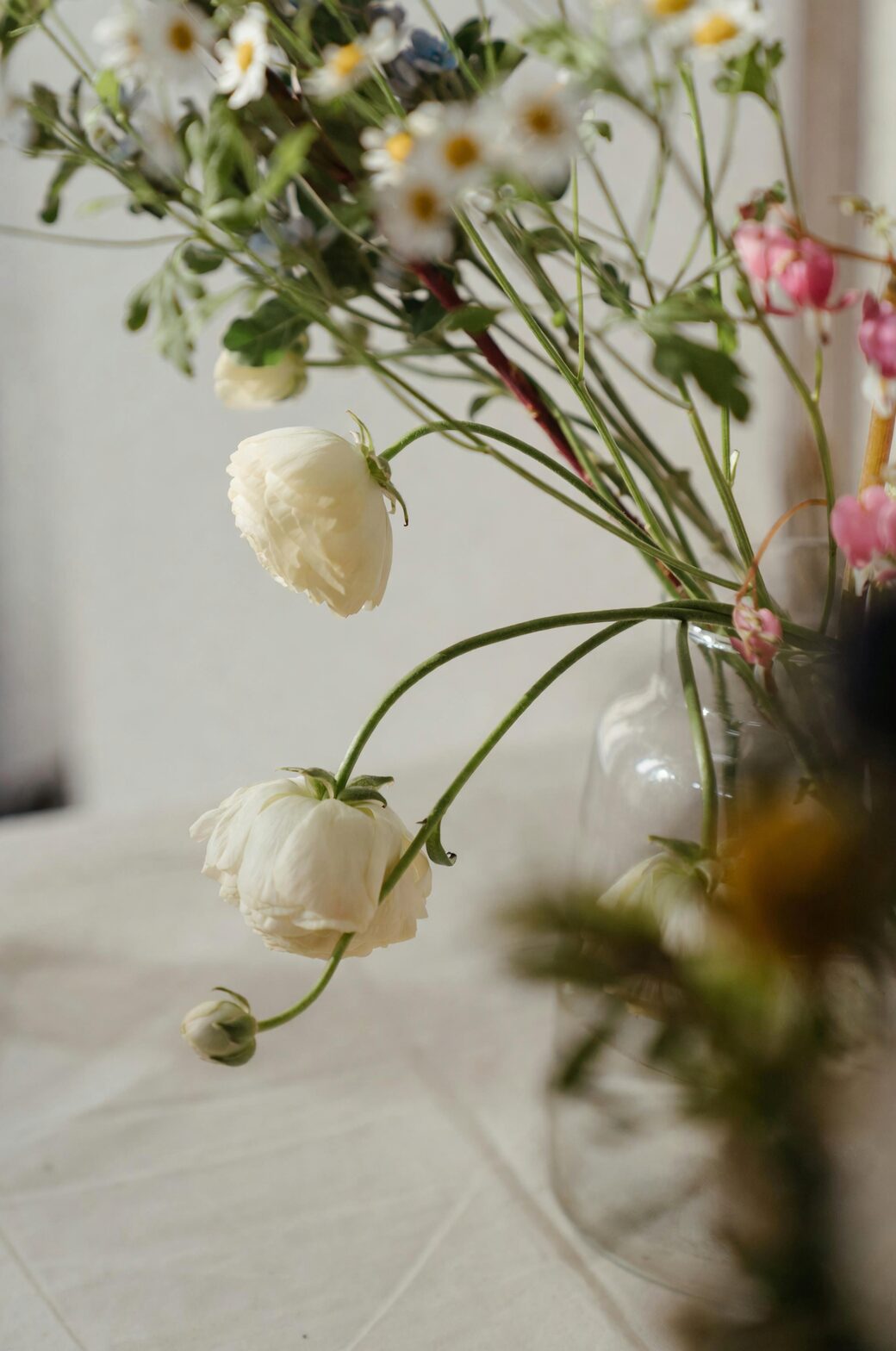 ranunculus arranging in glass vase