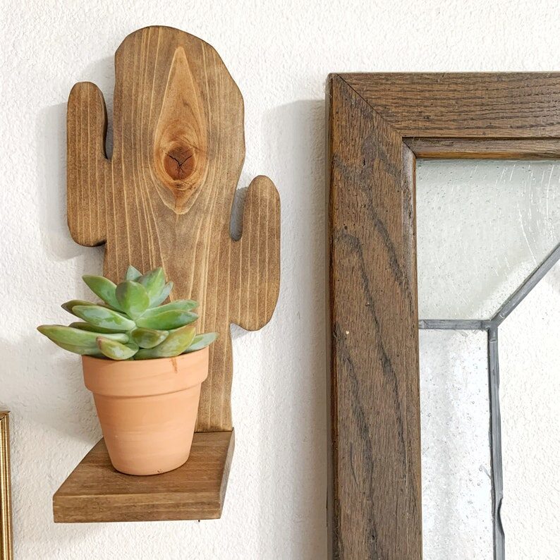 easter cactus on wooden wall shelf