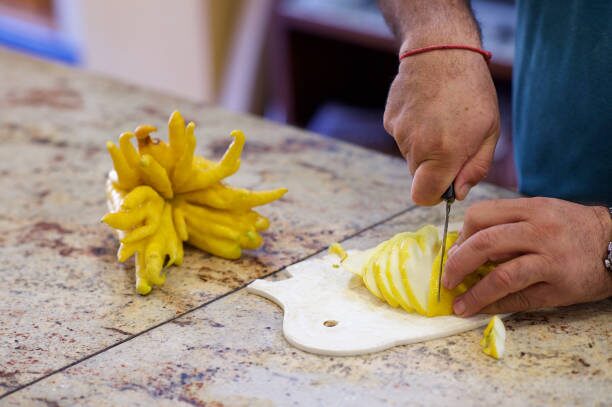 buddha's hand cutting in sand